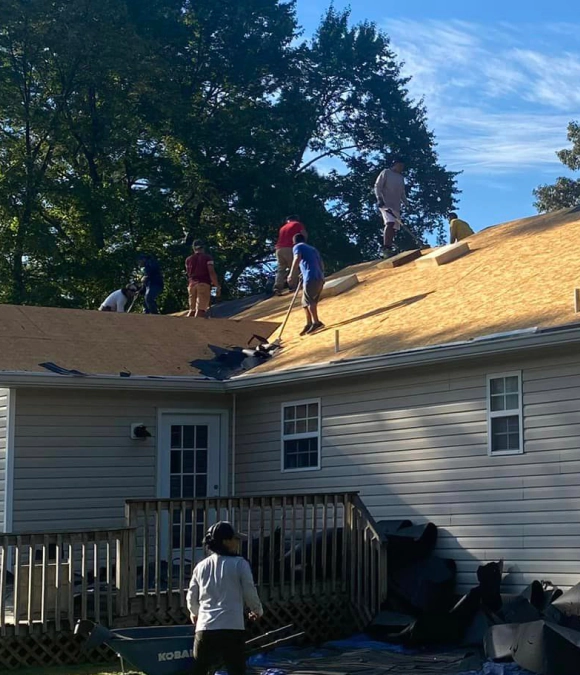 men working on a roof